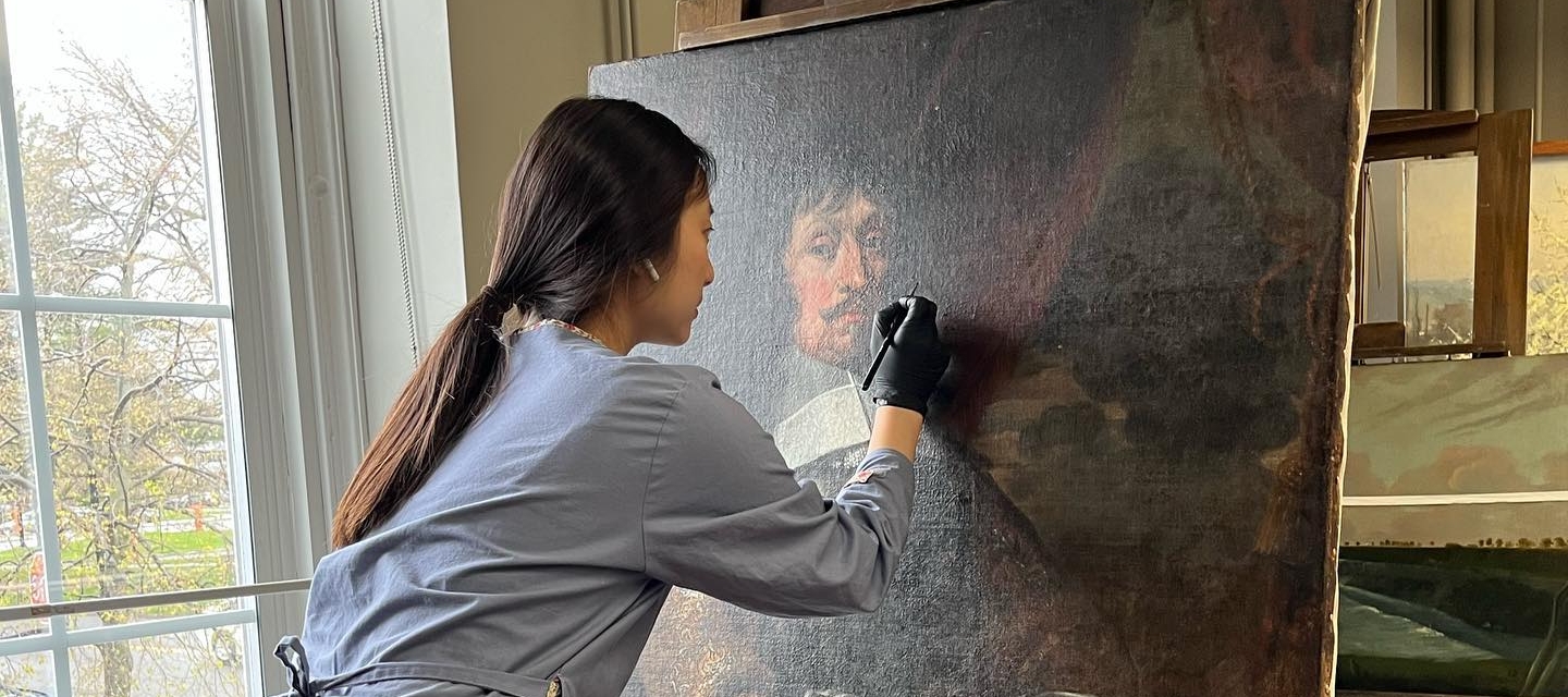 Student working in paintings conservation lab