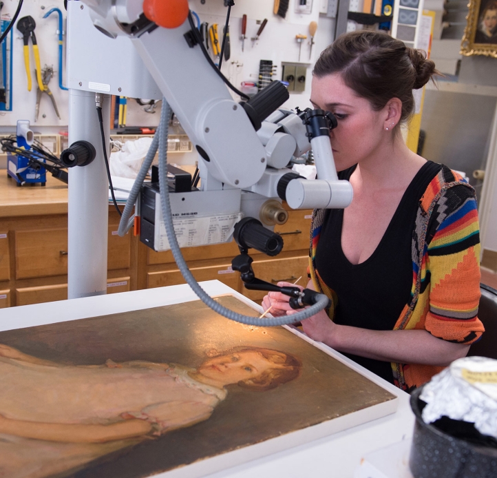 Student working on a painting