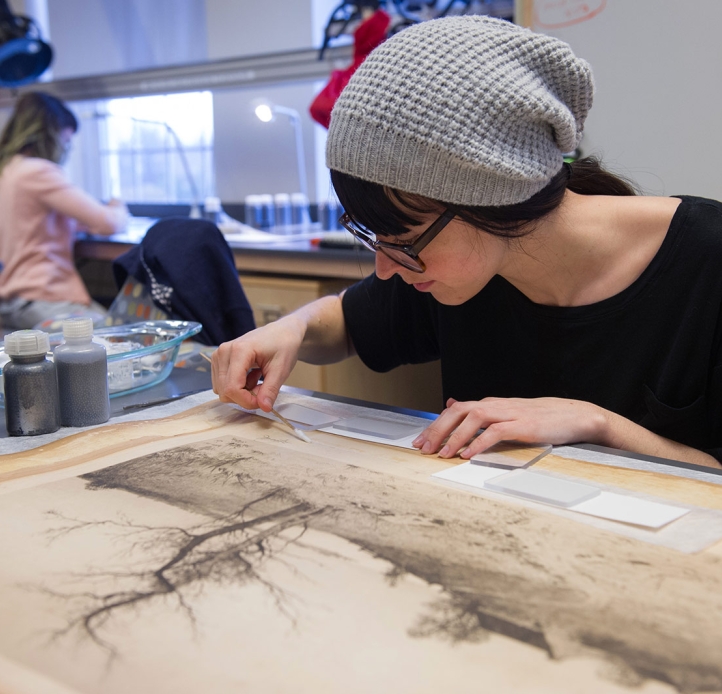 Student working on a paper object