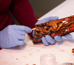 Student cleaning an object