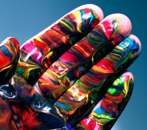 A hand paint in multi-colored paint