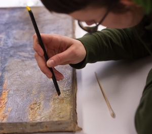 Student working on a painting