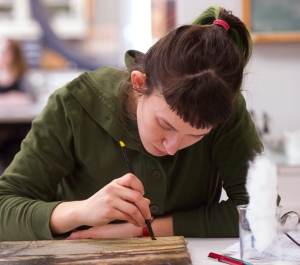 Student working on a painting