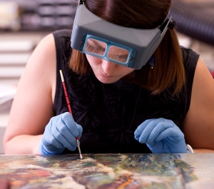 Student working on a painting