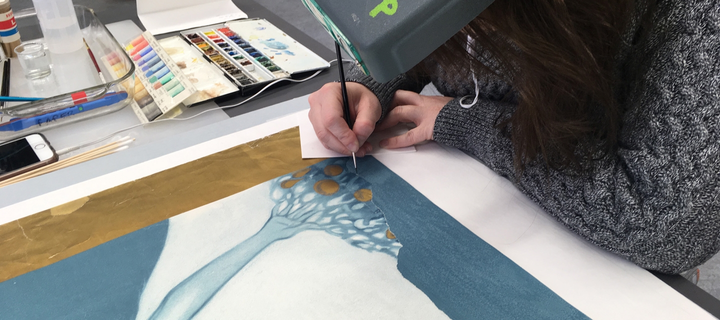 Student working on a poster
