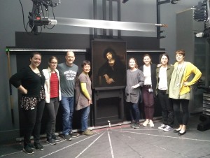 Faculty and students pose with the Rembrandt piece during examination